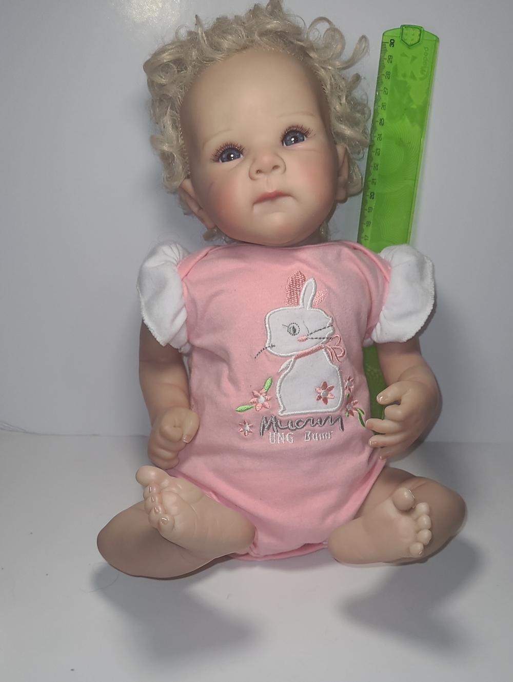 Reborn dolls Bettie ,Rxdoll,curly blond hairs , have a purple ink stain on cheek